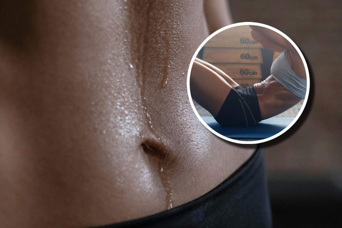 Una pancia sudata e, in evidenza, una ragazza che pratica un crunch